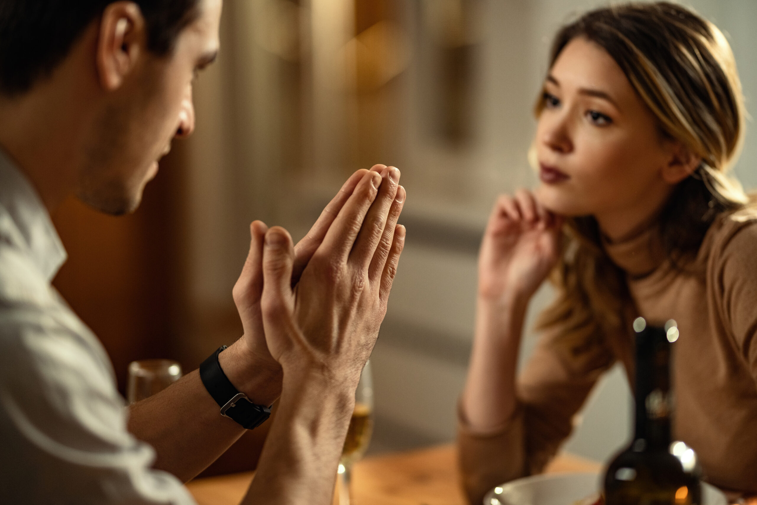 man begging his girlfriend to get help