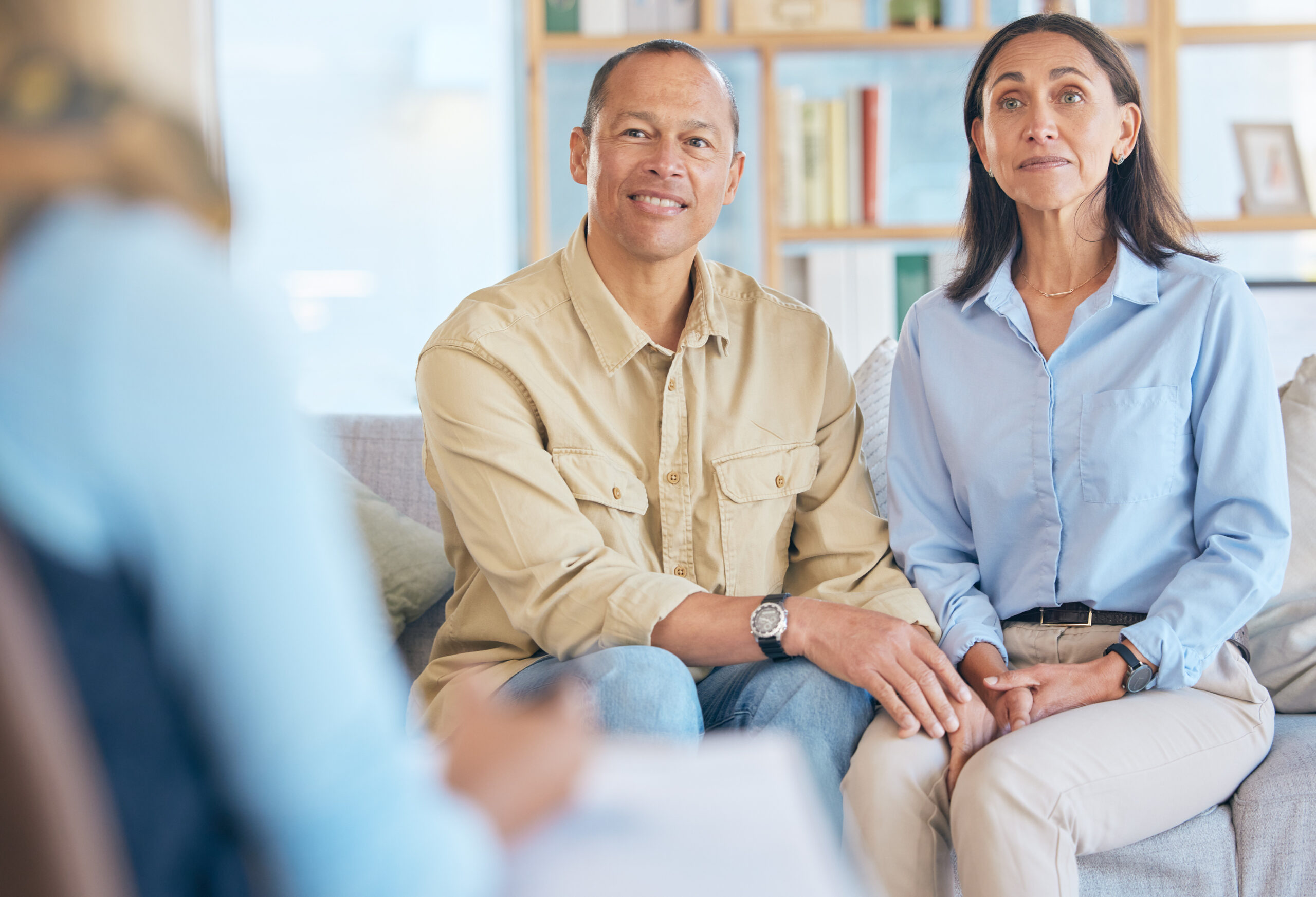 Couple, marriage therapy and relax on sofa together for counseling, psychologist conversation and m.