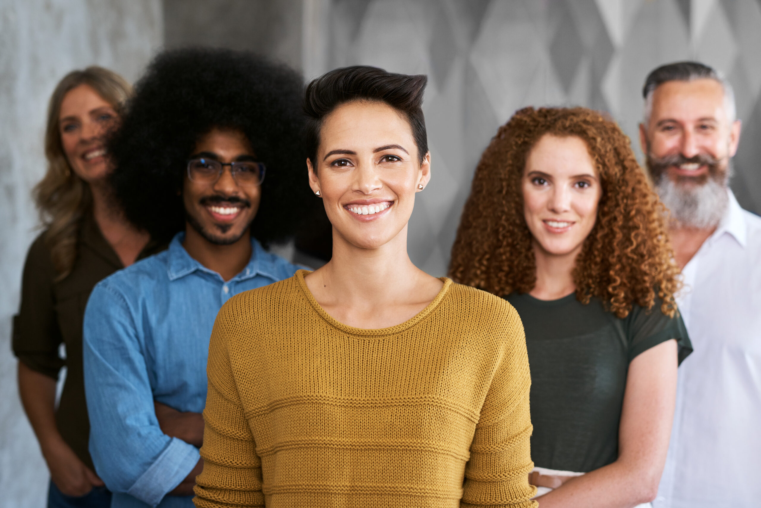 group of diverse people smiling at camera