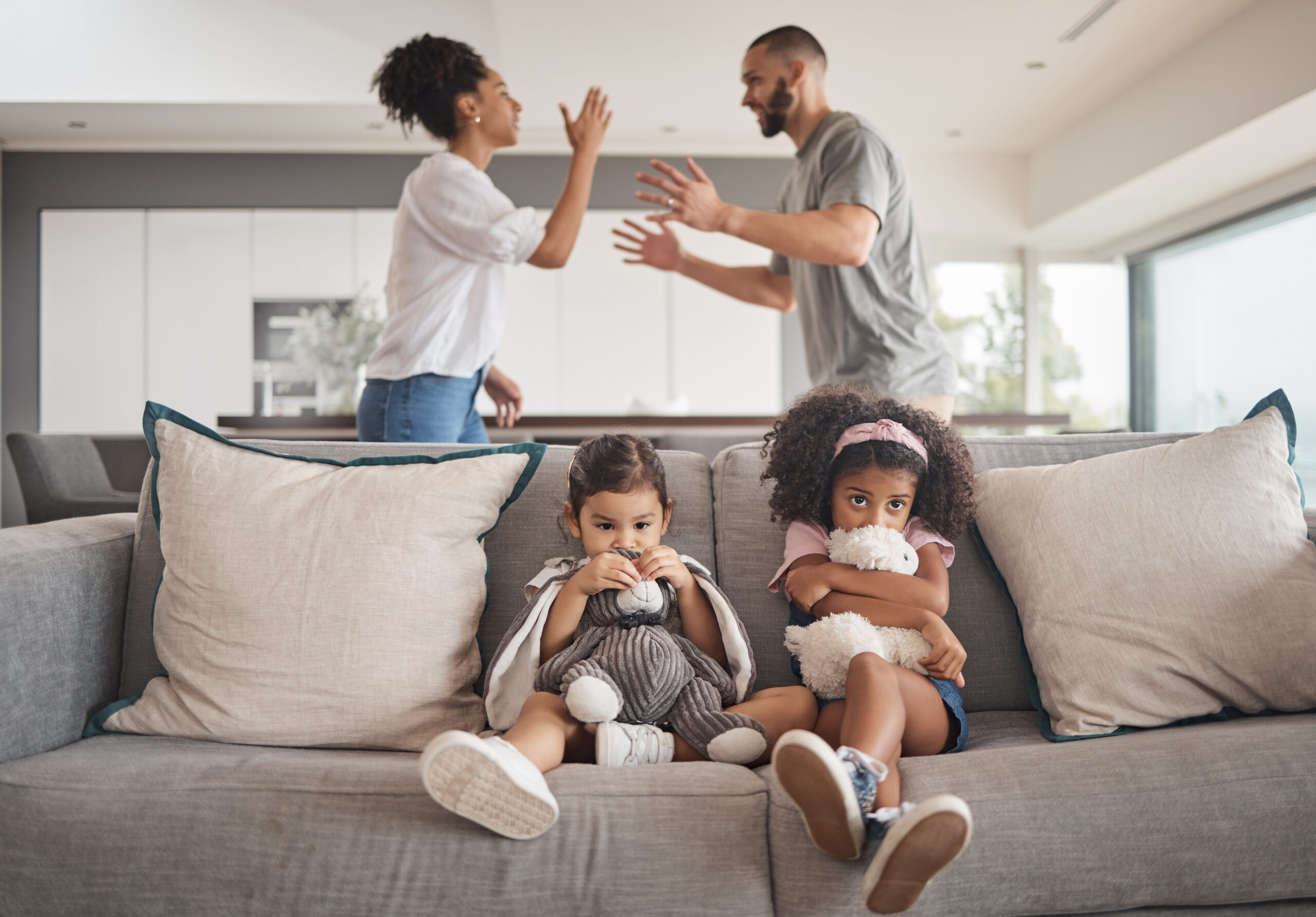 Angry parents, sad kids and divorce couple in living room from problem, family conflict and breakup.