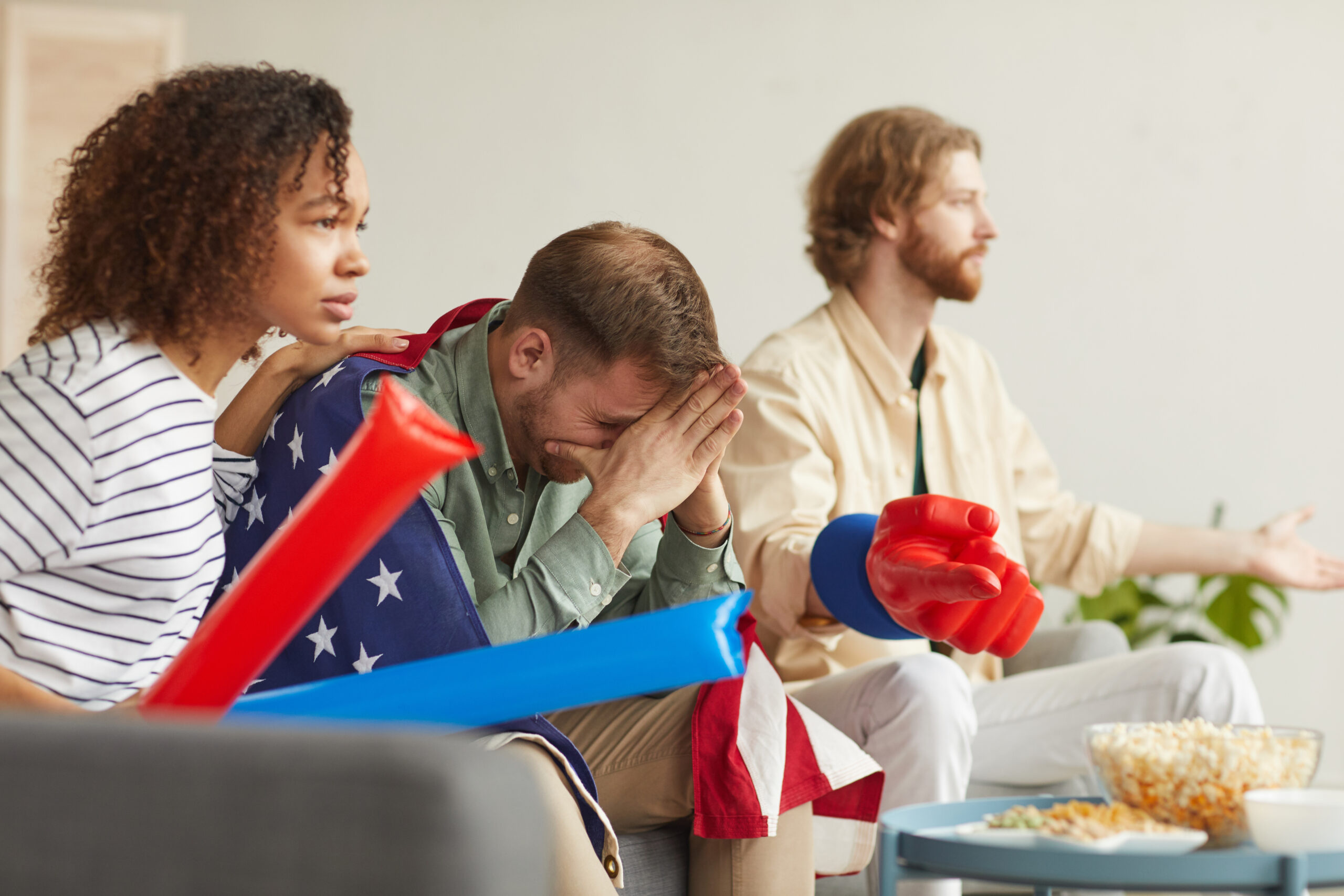 group of people frustrated watching tv