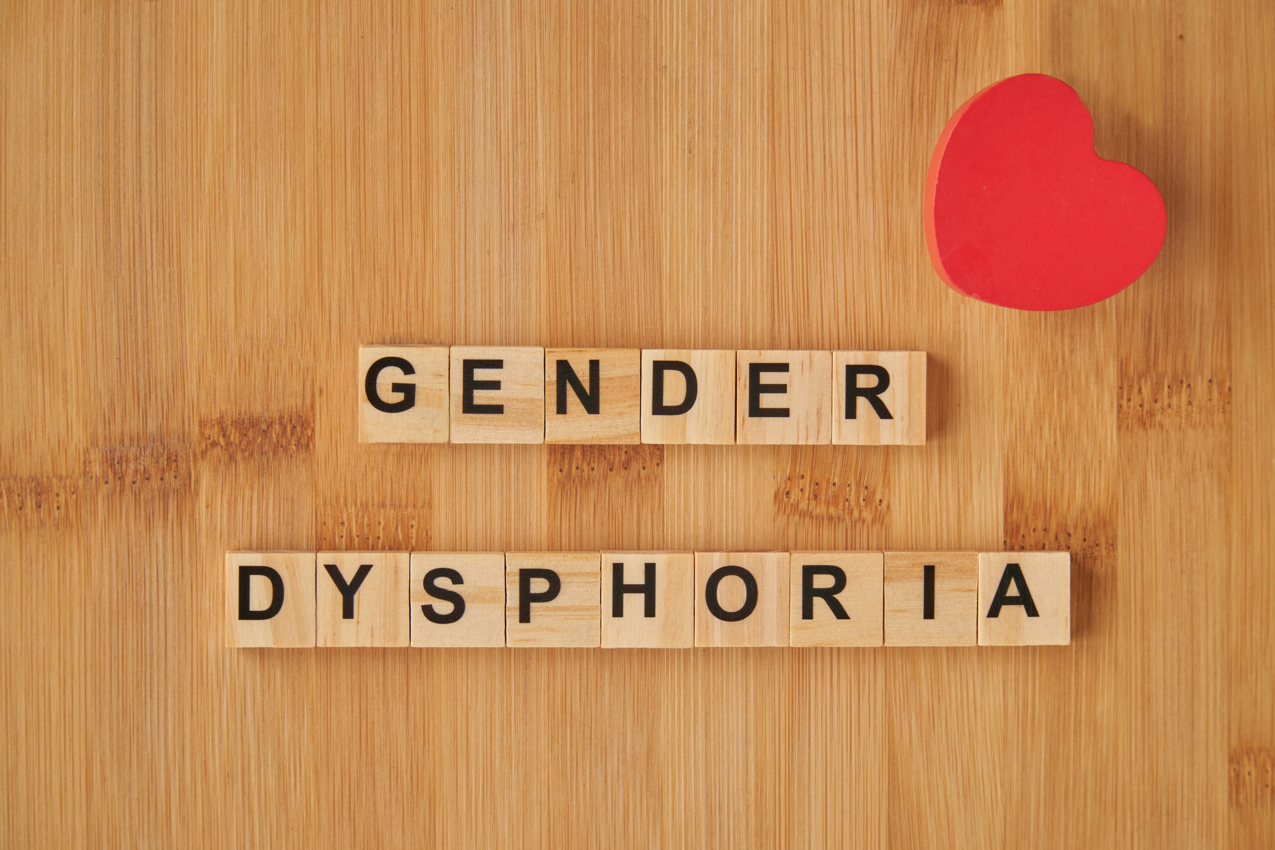 Gender dysphoria message in crossword puzzle with a heart as sign of pride and respect